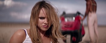 Movie still from “The Bad Batch” (2016), directed by Ana Lily Amirpour – A person with long brown hair; Close Up shot, Low angle