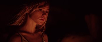 Movie still from “The Bad Batch” (2016), directed by Ana Lily Amirpour – A beautiful young woman with long blonde hair; Close Up shot, Low angle