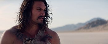 Movie still from “The Bad Batch” (2016), directed by Ana Lily Amirpour – A person with long hair; Close Up shot, Low angle