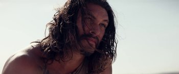 Movie still from “The Bad Batch” (2016), directed by Ana Lily Amirpour – A person with long hair; Close Up shot, Low angle