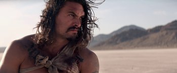 Movie still from “The Bad Batch” (2016), directed by Ana Lily Amirpour – A person with long hair; Close Up shot, Over the shoulder angle