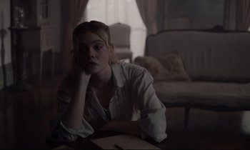 Movie still from “The Beguiled” (2017), directed by Sofia Coppola – A woman sitting on the floor in a living room; Medium shot, Over the shoulder angle