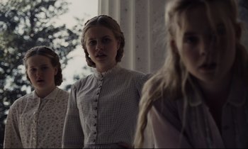Movie still from “The Beguiled” (2017), directed by Sofia Coppola – A group of young women standing next to each other; Medium shot, Low angle