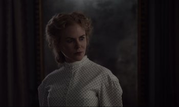 Movie still from “The Beguiled” (2017), directed by Sofia Coppola – A woman standing in front of a mirror in front of a wall; Close Up shot, Over the shoulder angle