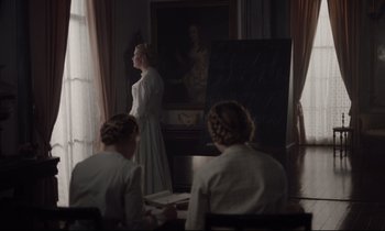 Movie still from “The Beguiled” (2017), directed by Sofia Coppola – A group of women sitting in front of a chalkboard; Wide shot, Over the shoulder angle