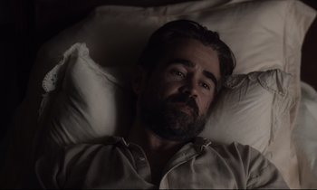 Movie still from “The Beguiled” (2017), directed by Sofia Coppola – A man laying in a bed with his eyes open; Close Up shot, High angle