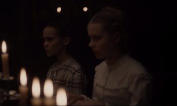 Movie still from “The Beguiled” (2017), directed by Sofia Coppola – A man and a woman standing in front of candles; Medium shot, Over the shoulder angle