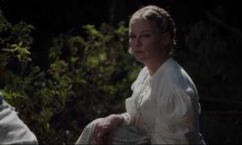 Movie still from “The Beguiled” (2017), directed by Sofia Coppola – A woman sitting in the shade of a tree; Close Up shot, High angle