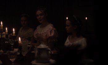 Movie still from “The Beguiled” (2017), directed by Sofia Coppola – A group of people sitting around a table; Medium shot, Over the shoulder angle