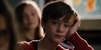 Movie still from “The Book of Henry” (2017), directed by Colin Trevorrow – A young boy sitting in front of a woman; Close Up shot, Over the shoulder angle