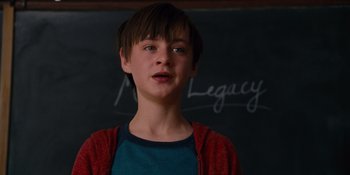 Movie still from “The Book of Henry” (2017), directed by Colin Trevorrow – A young boy standing in front of a blackboard; Close Up shot, Over the shoulder angle