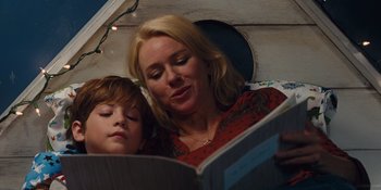 Movie still from “The Book of Henry” (2017), directed by Colin Trevorrow – A woman and a child reading a book; Close Up shot, Over the shoulder angle
