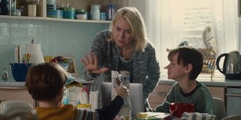 Movie still from “The Book of Henry” (2017), directed by Colin Trevorrow – A group of people sitting around a table; Medium shot, Over the shoulder angle