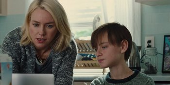 Movie still from “The Book of Henry” (2017), directed by Colin Trevorrow – A woman and a boy sitting next to each other on a laptop; Close Up shot, Over the shoulder angle