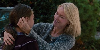 Movie still from “The Book of Henry” (2017), directed by Colin Trevorrow – A woman putting a necklace on a young girl's neck; Close Up shot, Over the shoulder angle