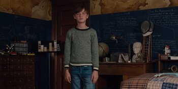 Movie still from “The Book of Henry” (2017), directed by Colin Trevorrow – A boy standing in front of a chalkboard; Medium shot, Over the shoulder angle
