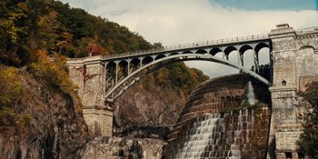 Movie still from “The Book of Henry” (2017), directed by Colin Trevorrow – A bridge over a river that is under a bridge; Extreme Wide shot, High angle