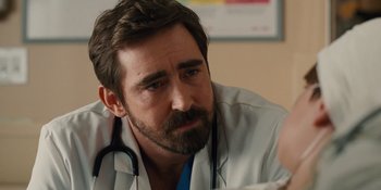 Movie still from “The Book of Henry” (2017), directed by Colin Trevorrow – A man with a stethoscope around his neck; Close Up shot, Over the shoulder angle