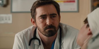 Movie still from “The Book of Henry” (2017), directed by Colin Trevorrow – A man with a stethoscope around his neck; Close Up shot, Low angle