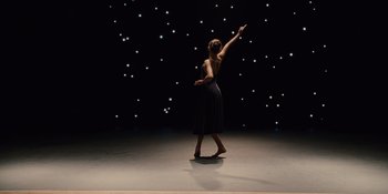 Movie still from “The Book of Henry” (2017), directed by Colin Trevorrow – A woman standing on one foot on a dance floor; Wide shot, Low angle