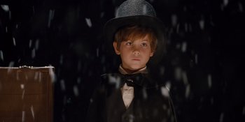 Movie still from “The Book of Henry” (2017), directed by Colin Trevorrow – A young boy wearing a hat and a bow tie; Close Up shot, Low angle