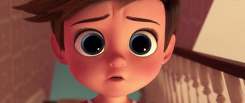 Movie still from “The Boss Baby” (2017), directed by Tom McGrath – An animated boy with big blue eyes looking at the camera; Close Up shot, Over the shoulder angle