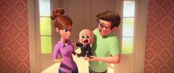 Movie still from “The Boss Baby” (2017), directed by Tom McGrath – An animated woman holding a baby and a man holding a baby; Medium shot, Over the shoulder angle