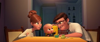 Movie still from “The Boss Baby” (2017), directed by Tom McGrath – A family sitting at a table with a baby; Medium shot, Over the shoulder angle