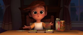 Movie still from “The Boss Baby” (2017), directed by Tom McGrath – A cartoon boy sitting in front of a tray of food; Medium shot, High angle