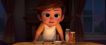 Movie still from “The Boss Baby” (2017), directed by Tom McGrath – A boy is sitting in front of a tray of food; Close Up shot, High angle