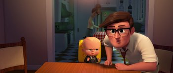 Movie still from “The Boss Baby” (2017), directed by Tom McGrath – An image of an animated character and a baby doll; Medium shot, Over the shoulder angle