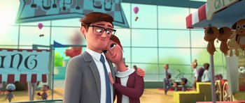 Movie still from “The Boss Baby” (2017), directed by Tom McGrath – An animated man and a woman hugging each other in front of a building; Medium shot, Low angle