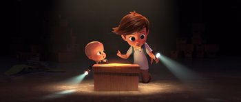 Movie still from “The Boss Baby” (2017), directed by Tom McGrath – A cartoon of a boy looking at a small boy; Medium shot, High angle