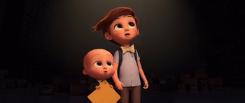 Movie still from “The Boss Baby” (2017), directed by Tom McGrath – Two animated characters one of them is holding a book and the other is holding a baby head; Medium shot, High angle