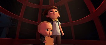 Movie still from “The Boss Baby” (2017), directed by Tom McGrath – Two animated characters are standing next to each other; Medium shot, High angle