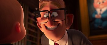 Movie still from “The Boss Baby” (2017), directed by Tom McGrath – An animated man wearing glasses and a suit; Close Up shot, Over the shoulder angle