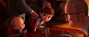 Movie still from “The Boss Baby” (2017), directed by Tom McGrath – A person is sitting in front of a cartoon character; Medium shot, Over the shoulder angle
