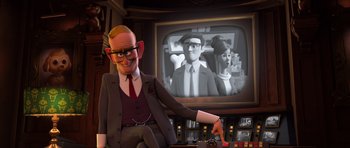 Movie still from “The Boss Baby” (2017), directed by Tom McGrath – An animated man sitting in front of a television; Medium shot, Over the shoulder angle