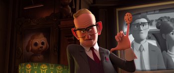 Movie still from “The Boss Baby” (2017), directed by Tom McGrath – An animated man wearing glasses and a suit; Close Up shot, Over the shoulder angle