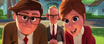 Movie still from “The Boss Baby” (2017), directed by Tom McGrath – A man and two women standing next to each other in front of a building; Medium shot, Over the shoulder angle