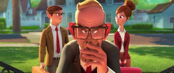 Movie still from “The Boss Baby” (2017), directed by Tom McGrath – An animated man holding a chocolate chip cookie while two other people look on; Medium shot, Over the shoulder angle
