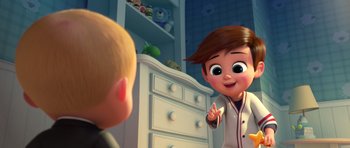 Movie still from “The Boss Baby” (2017), directed by Tom McGrath – A cartoon of a little boy talking to another cartoon character; Medium shot, Over the shoulder angle