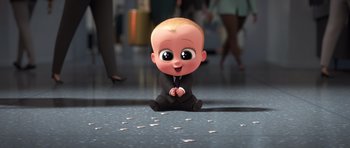 Movie still from “The Boss Baby” (2017), directed by Tom McGrath – A cartoon baby sitting on the ground in a suit; Wide shot, High angle