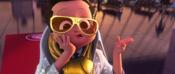 Movie still from “The Boss Baby” (2017), directed by Tom McGrath – A cartoon character with a gold jacket and sunglasses; Close Up shot, High angle