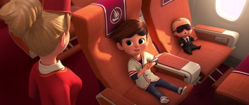 Movie still from “The Boss Baby” (2017), directed by Tom McGrath – A boy is sitting on a seat on a plane; Medium shot, High angle