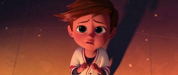 Movie still from “The Boss Baby” (2017), directed by Tom McGrath – A boy with a baseball uniform is looking sad; Close Up shot, High angle
