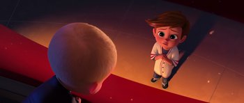 Movie still from “The Boss Baby” (2017), directed by Tom McGrath – A boy is looking at himself in the mirror; Medium shot, High angle