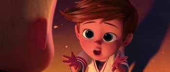 Movie still from “The Boss Baby” (2017), directed by Tom McGrath – A cartoon of a boy looking surprised at the camera; Medium shot, Over the shoulder angle