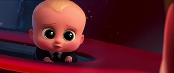 Movie still from “The Boss Baby” (2017), directed by Tom McGrath – A cartoon of a little boy with a suit and tie on; Medium shot, High angle