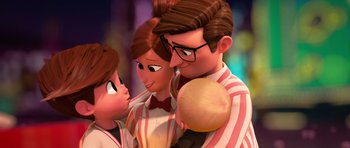 Movie still from “The Boss Baby” (2017), directed by Tom McGrath – A man and two women standing next to each other; Medium shot, Over the shoulder angle